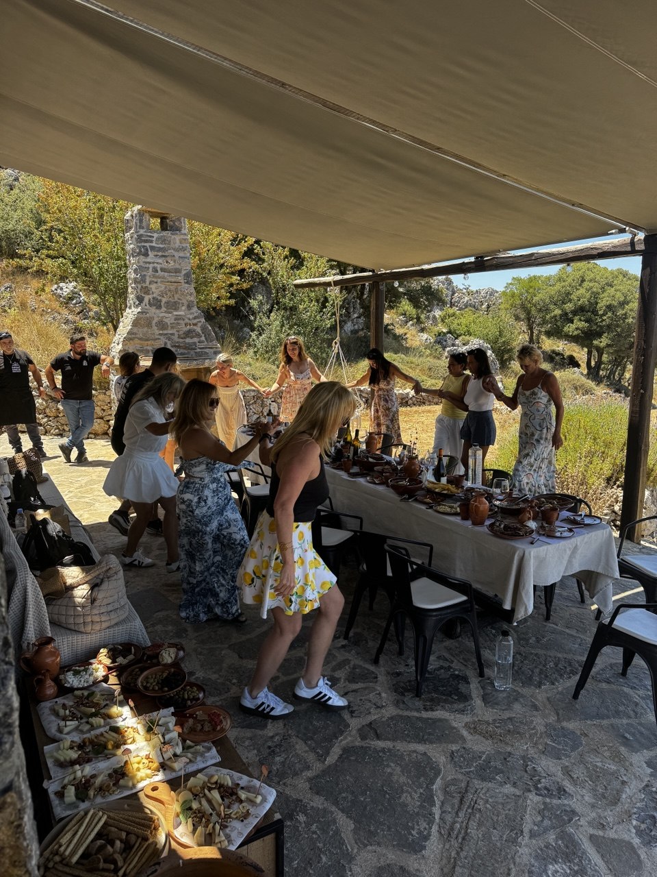 Crete retreat guests dancing before lunch