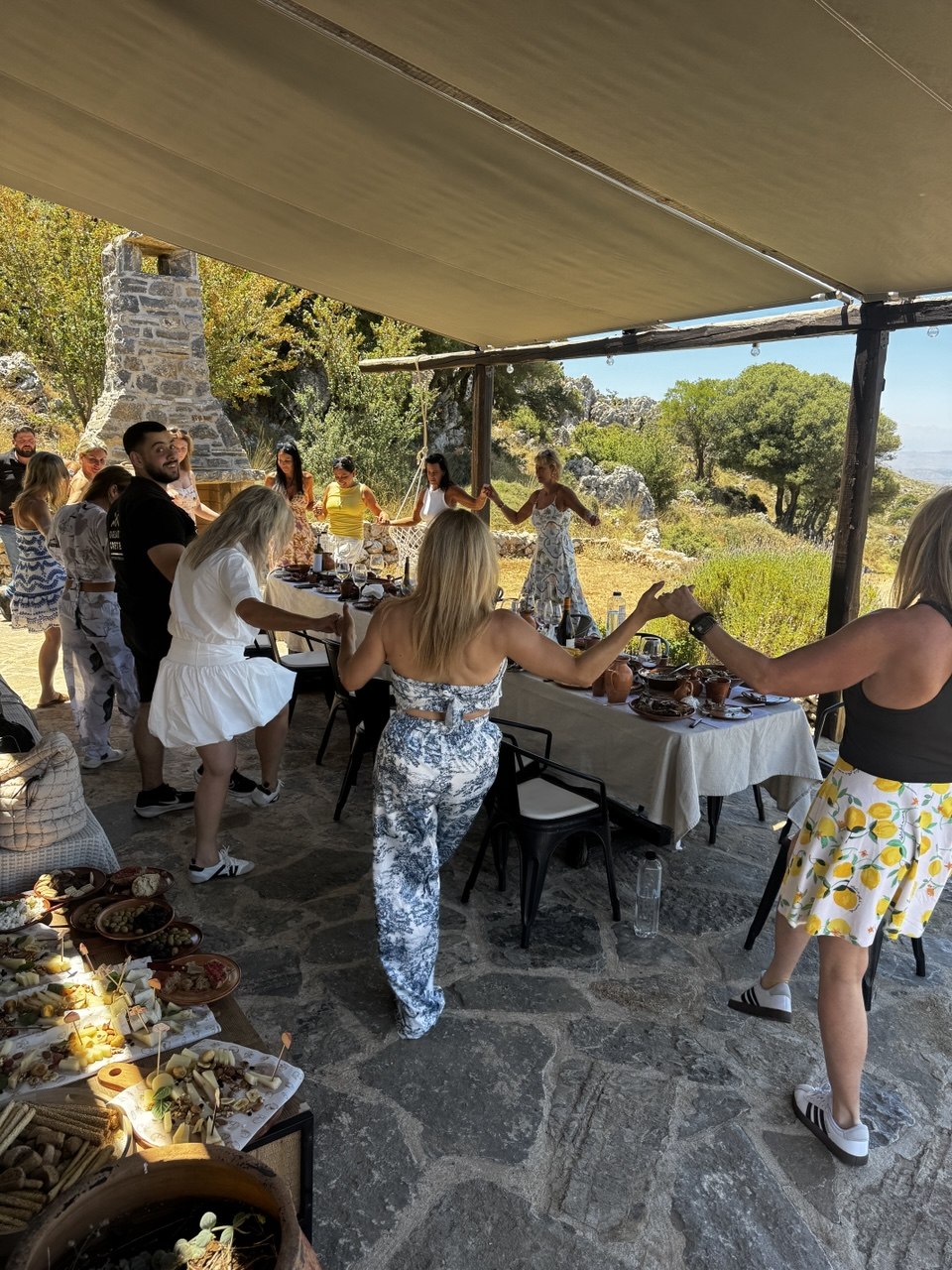 Crete retreat group gathering at an outdoor table